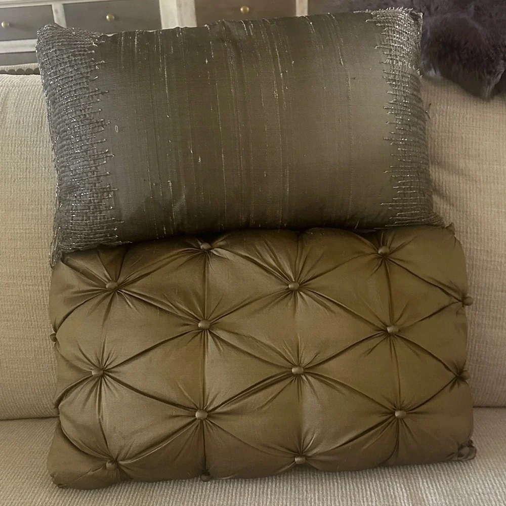 Two green 20 inch long silk pillows